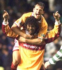 Benito Kemble and Michel Doesburg celebrate a famous win at Parkhead.
