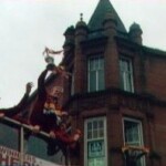Kirk holds the trophy aloft as the side tour the town.